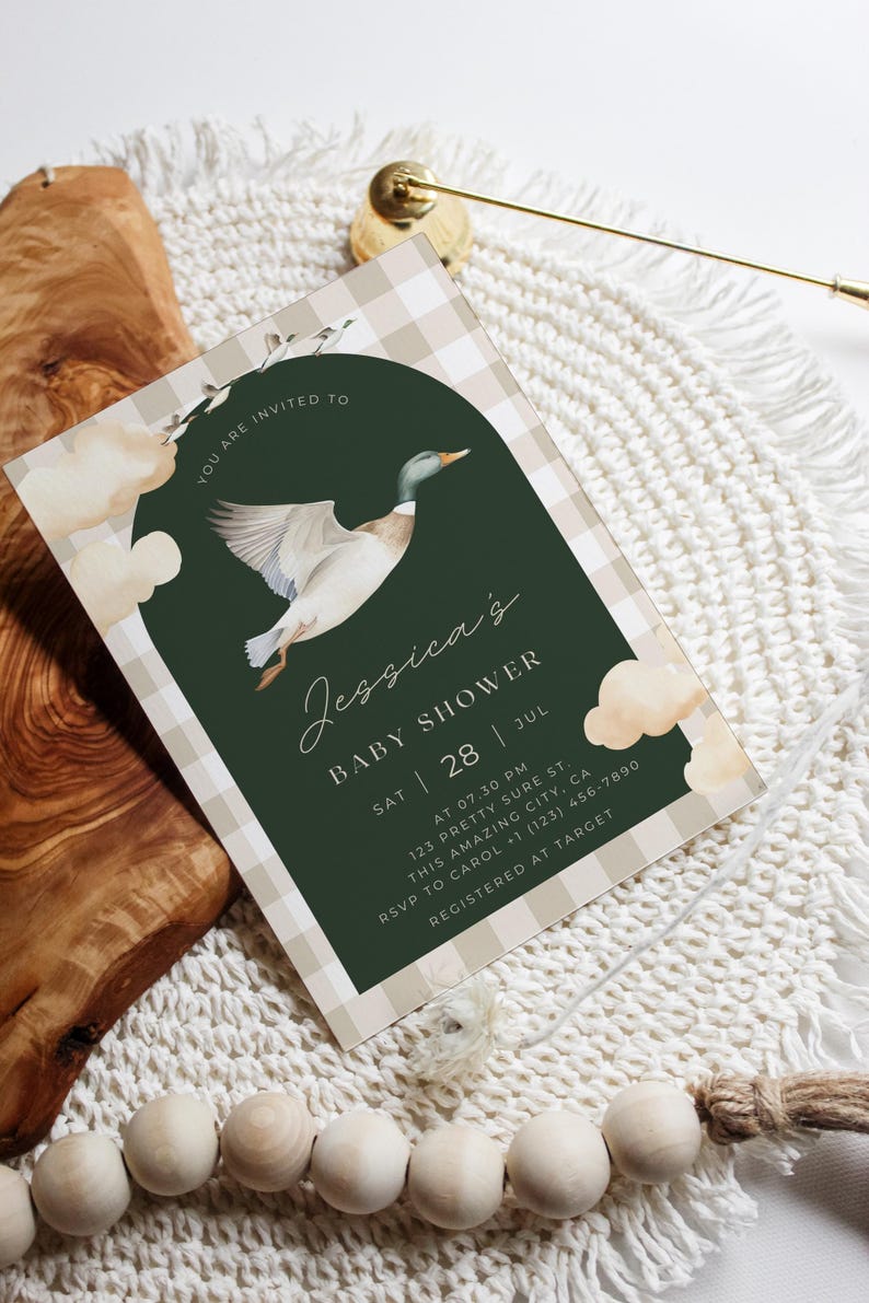 May include: A green and white gingham patterned baby shower invitation with a watercolor illustration of a duck flying. The text reads "You are invited to Jessica's Baby Shower Sat 28 Jul at 07.30 PM 123 Pretty Sure St. This Amazing City, CA RSVP to Carol +1 (123) 456-7890 Registered at Target"