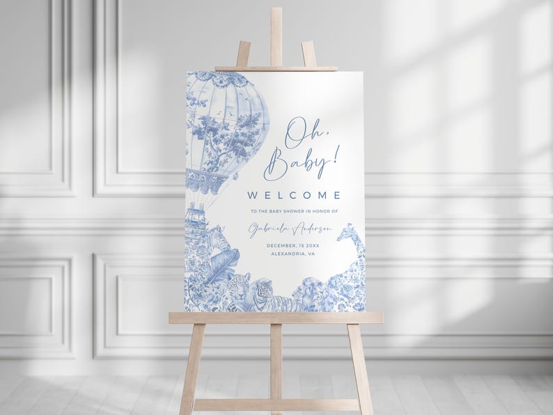May include: Blue and white baby shower welcome sign with a hot air balloon and giraffe illustration. The text reads "Oh Baby! Welcome to the baby shower in honor of Gabriela Anderson, December 18, 20XX, Alexandria, VA."