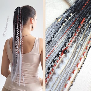 May include: A ponytail hairstyle featuring gray, black, and red braided extensions. The extensions are adorned with wooden beads and decorative wraps. The text "27 Hair Treasures" is visible on the side of the image.