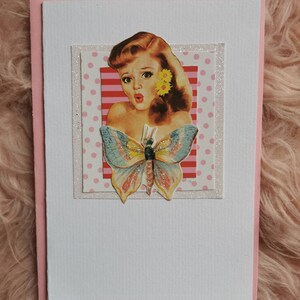 Handmade lovely blonde vintage pinup girl with butterflies on a glitter sparkly background greeting card
