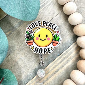 Smiley Face Badge Reel: Love Peace Hope ID Holder