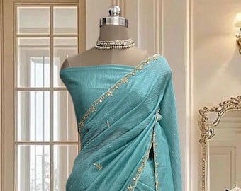 Aqua blue crushed chinon saree with delicate hand embroidered border and running blouse piece
