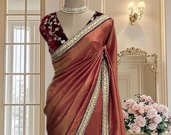Maroon gold shimmer saree with delicate border and maroon velvet blouse piece.