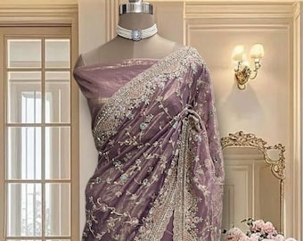 Purple shimmer net saree with glitter work and running blouse piece