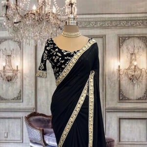 Jet black georgette saree with border and stitched designer velvet blouse