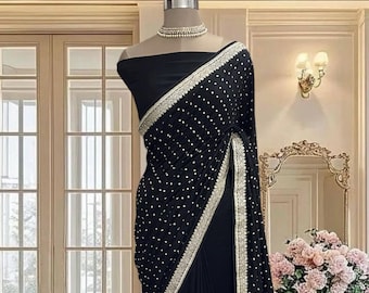Black vichitra silk saree with sari butti work, delicate border and running blouse piece