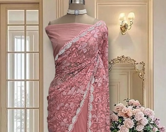 Peach net saree with thread and stone work and running blouse piece
