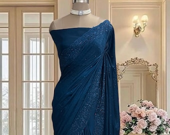 Peacock blue Dola silk saree with cutwork floral border and running blouse piece