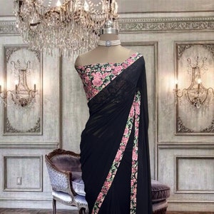 Jet black georgette saree with printed border and printed blouse piece