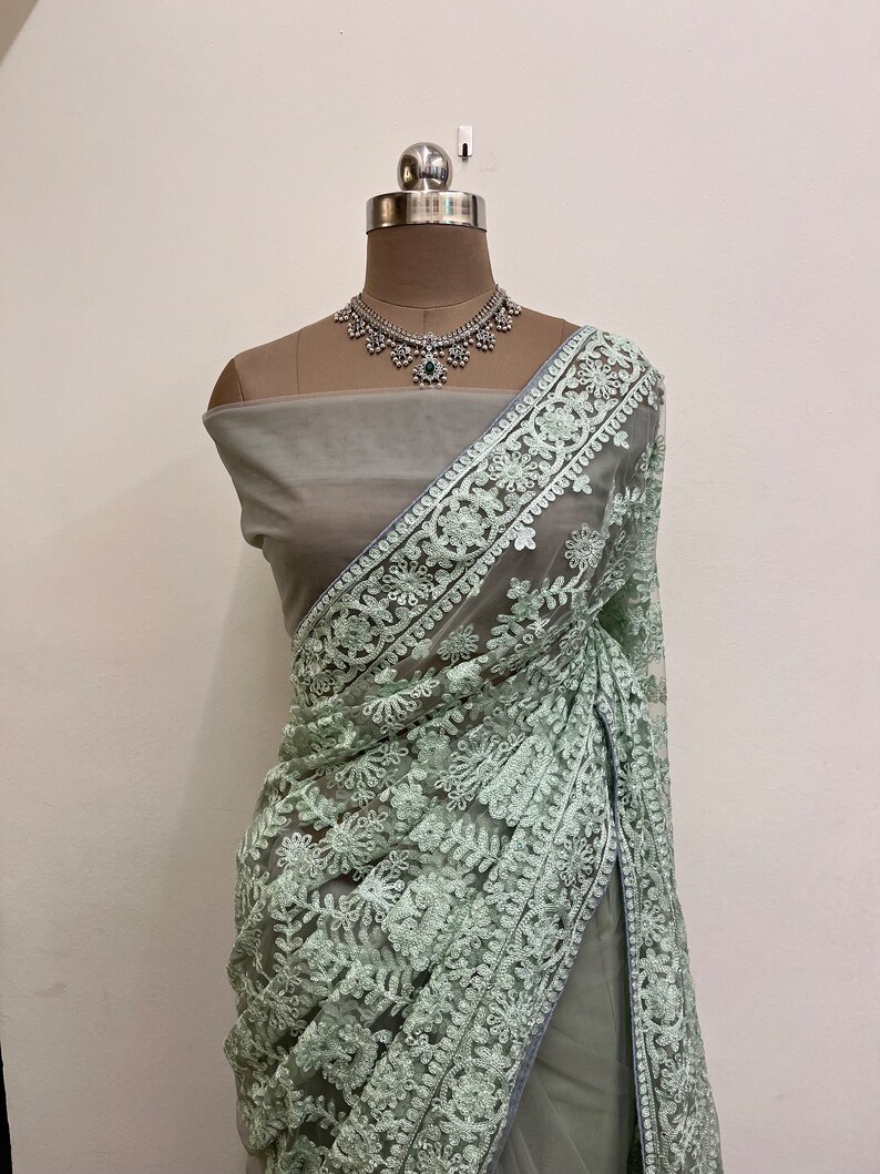 Pastel Thread Embroidered Net Saree With Stone Work & Cutwork Border main image 0