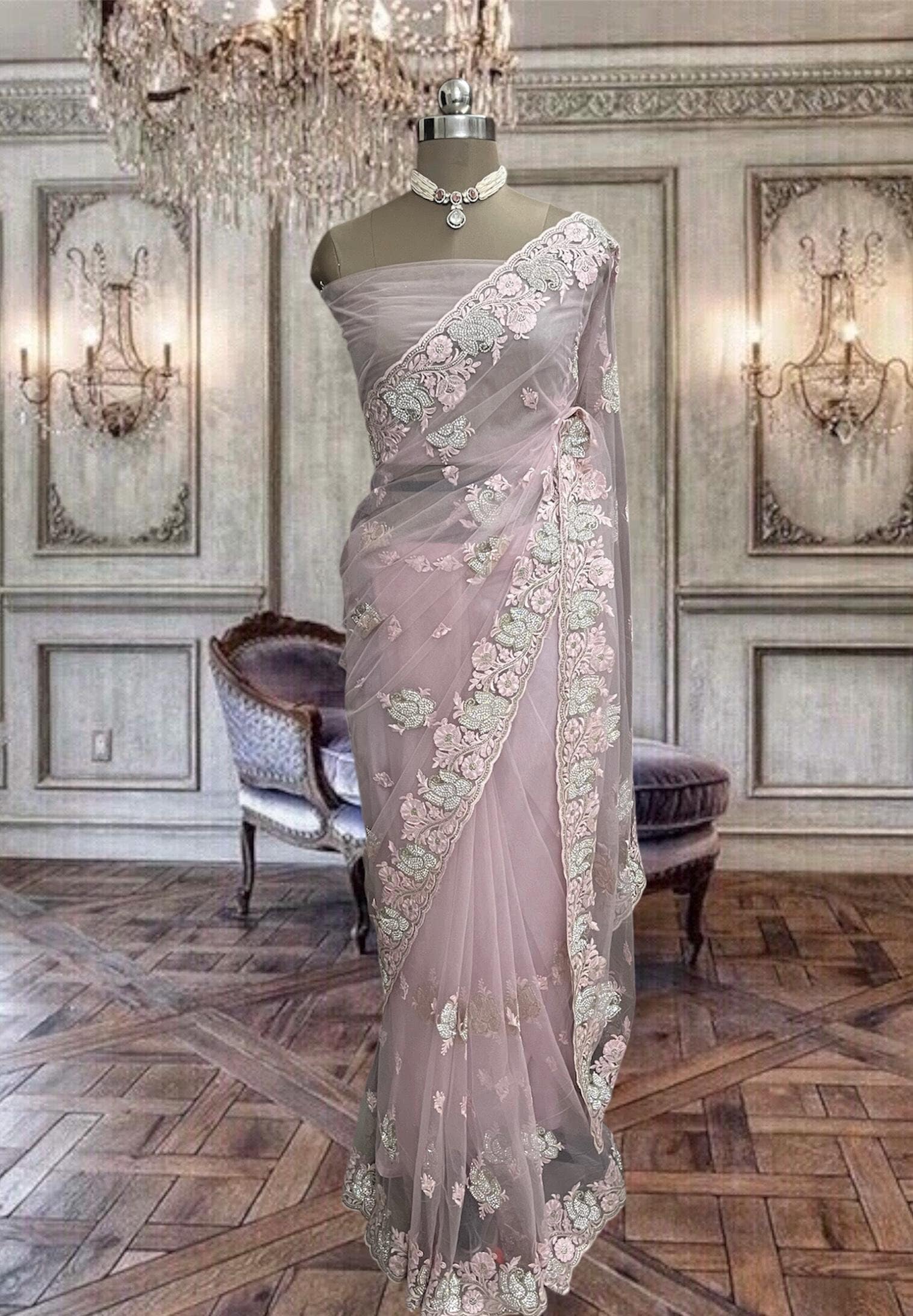 Pastel pink net saree with thread and stone work and running blouse piece
