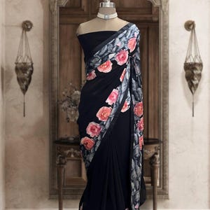 Jet black georgette saree with printed patchwork border and black blouse piece