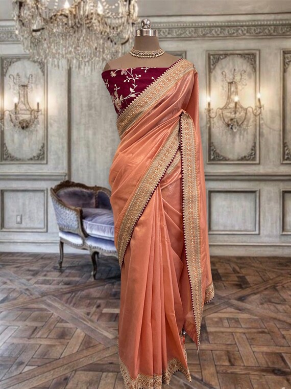peach saree with golden blouse
