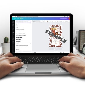 May include: A laptop displays a birthday invitation design with a brown and white cowhide pattern. The invitation features a cowboy boot, hat, and sunflowers. The word "EXAMPLE" is overlaid on the design. The laptop is on a desk with a cactus, clock, and glasses.
