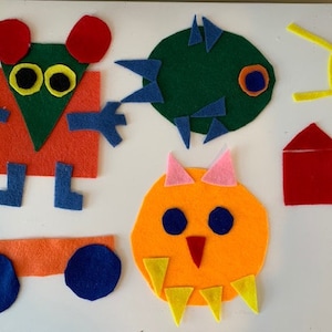 May include: Felt craft shapes in various colors, including a green monster, a red house, a yellow sun, an orange owl, a blue and green mouse, and a green tree.