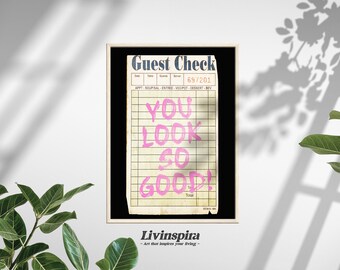 Puede incluir: Una impresión enmarcada de un cheque de restaurante vintage con el texto "YOU LOOK SO GOOD!" escrito en rosa en el cheque. La impresión está sobre un fondo blanco con un marco negro. El texto "Livinspira - art that inspires your living -" está debajo del marco.