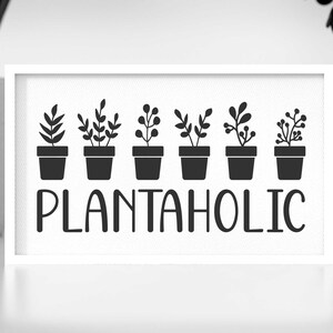 May include: Black and white sign with the text "Plantaholic" and a row of seven potted plants with different leaf shapes.