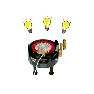Peut inclure: Un enrouleur de fil noir et rouge avec une bobine de fil blanc et une manivelle dor&eacute;e. Trois ampoules jaunes sont au-dessus de l'enrouleur, sugg&eacute;rant des id&eacute;es pour l'artisanat.