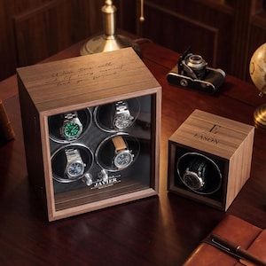 May include: A wooden watch winder box for four watches with the text "Wear time well, and let every moment lead you forward" and "JAVIER MAY.26.2024" and a smaller single watch winder box with the letter "E" and "EASON" engraved on top.