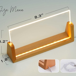 a wooden stand with a white light on top of it