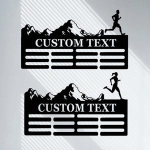 Könnte beinhalten: Schwarze Wanddekoration aus Metall mit einem Bergketten-Design und einer Silhouette einer laufenden Figur. Die Dekoration verfügt über einen anpassbaren Textbereich und eine Reihe von Linien zur Aufzeichnung von Leistungen.
