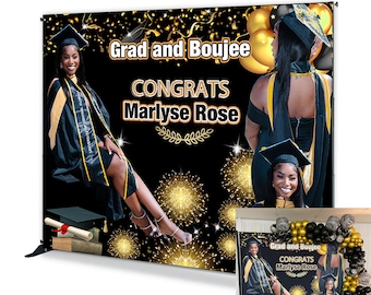 May include: A black and gold graduation backdrop with a photo of a graduate in a cap and gown. The backdrop has the text "Grad and Boujee" and "Congrats Marylse Rose".