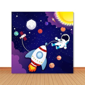 May include: A blue and purple space-themed backdrop with a white rocket, an astronaut, and planets. The rocket has a red and orange flame and a blue and white design. The astronaut is wearing a white spacesuit with a blue helmet. The planets are red, orange, and brown.