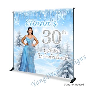 May include: A blue and white winter wonderland themed backdrop with a woman in a blue sequined dress. The backdrop features the text "Eliana's 30th Winter Wonderland".
