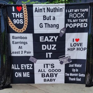 May include: Black and white banner with the text "Ain't Nuthin' But a G Thang", "Eazy Duz It", "I Love Hip Hop", "I Let My Tape Rock Til My Tape Popped", "Bamboo Earrings At Least 2 Pair", "All Eyez On Me", "It's All Good Baby Baby", and "Just Wakin' Up In The Mornin' Gotta Thank God".
