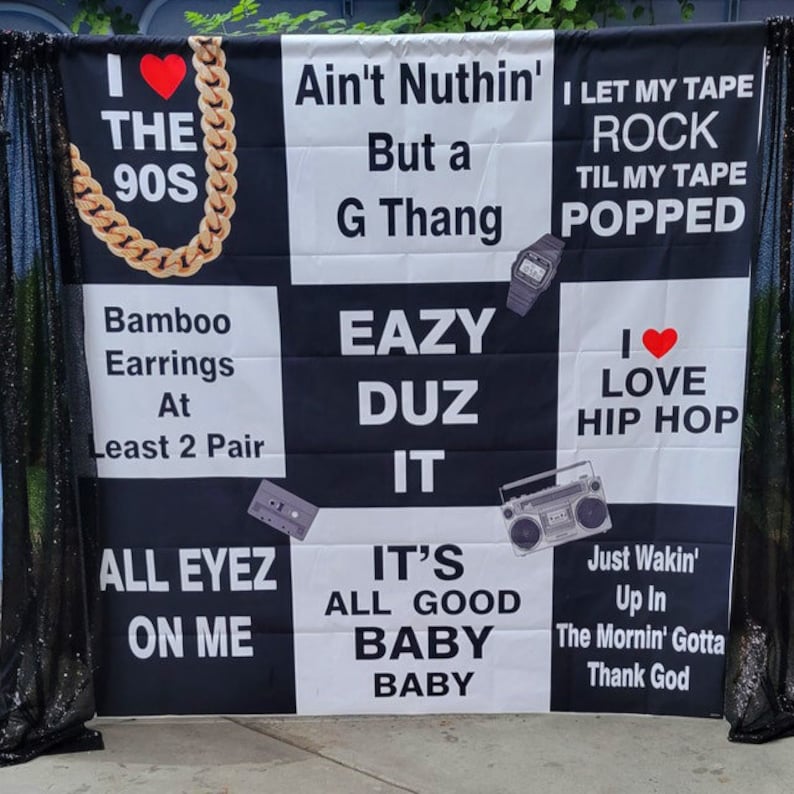 May include: Black and white banner with the text "Ain't Nuthin' But a G Thang", "Eazy Duz It", "I Love Hip Hop", "I Let My Tape Rock Til My Tape Popped", "Bamboo Earrings At Least 2 Pair", "All Eyez On Me", "It's All Good Baby Baby", and "Just Wakin' Up In The Mornin' Gotta Thank God".