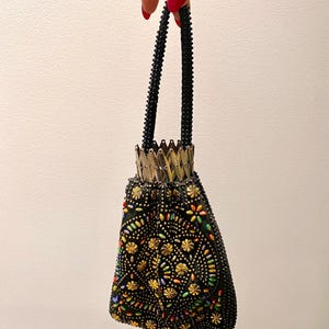 1960’s black, gold and multicoloured beggars purse