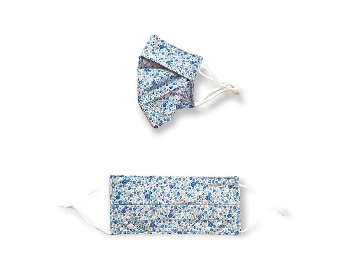 Blue ditsy face mask. Washable and reusable with filter pocket. Adjustable elastic ear loops with toggle adjustment.