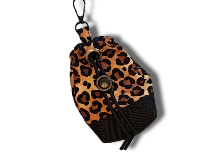 Leopard print dog treat bag with poo bag holder compartment and drawstring opening/closing