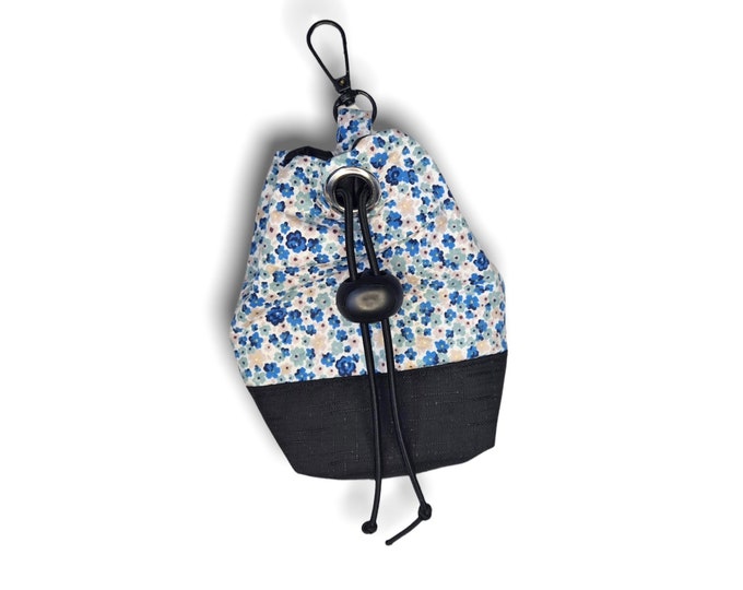 Blue ditsy dog treat bag with poo bag holder compartment and drawstring opening/closing
