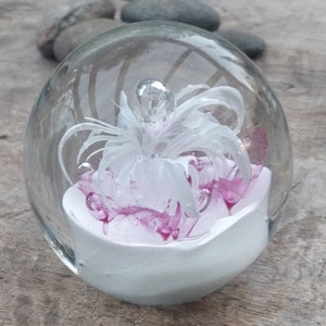 Paperweight with a white flower