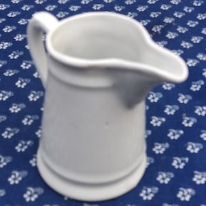 Old small porcelain milk jug