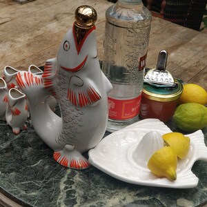 Traditional vodka carafe made of Lomonossow porcelain with matching shot glasses, hand-painted