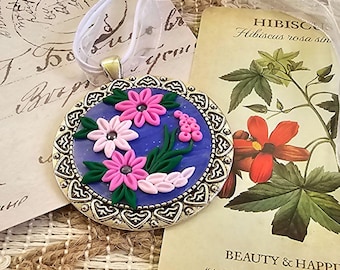 Handmade clay floral pendant necklace, Polymer clay flower necklace in purple and pink set into a filigree bezel, Flower necklace
