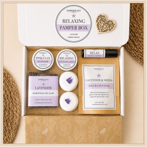 May include: A relaxing pamper box containing lavender-scented spa products. The box includes a face mask, soy wax candle, essential oil blend, bath and foot soak, essential oil soap, and bath bombs. All products are handmade in England.