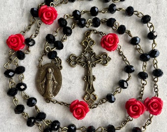 Handcrafted Catholic Prayer Rosary. Black crystals with Red rose beads accent & bronze cross and medallion. Floral Pirate Rosary