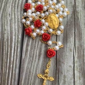 Beautiful Handcrafted Prayer Rosary. Made with red rose beads, pearls, gold crucifix and Virgin Mary medallion. Great Christmas gift!
