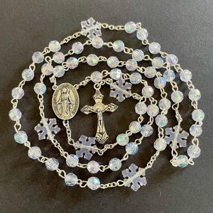 Catholic Prayer Christmas Rosary. Shimmering beads with evergreen Christmas tree beads and , silver crucifix. Christmas rosary, Holidays