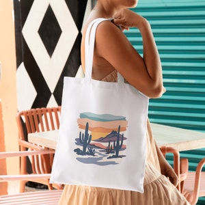 women with stylish tote bag, desert scene watercolor print on bag.