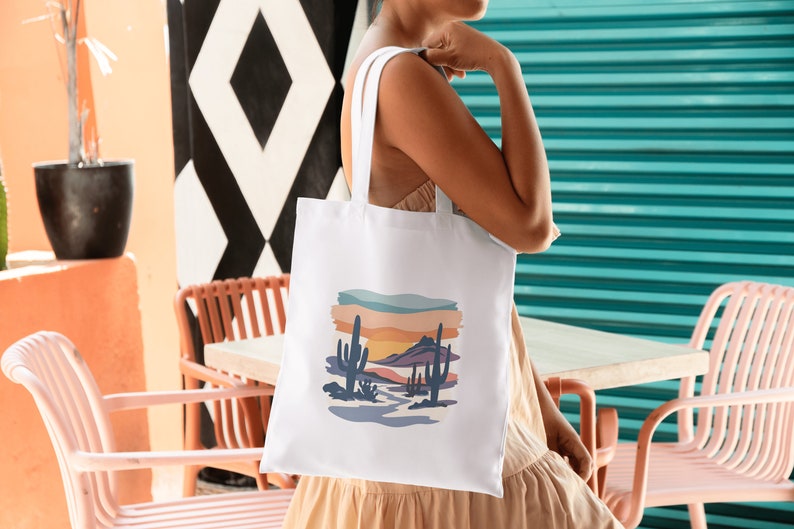 women with stylish tote bag, desert scene watercolor print on bag.