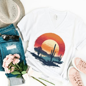 T-shirt with desert scene print with sunset and cactus.