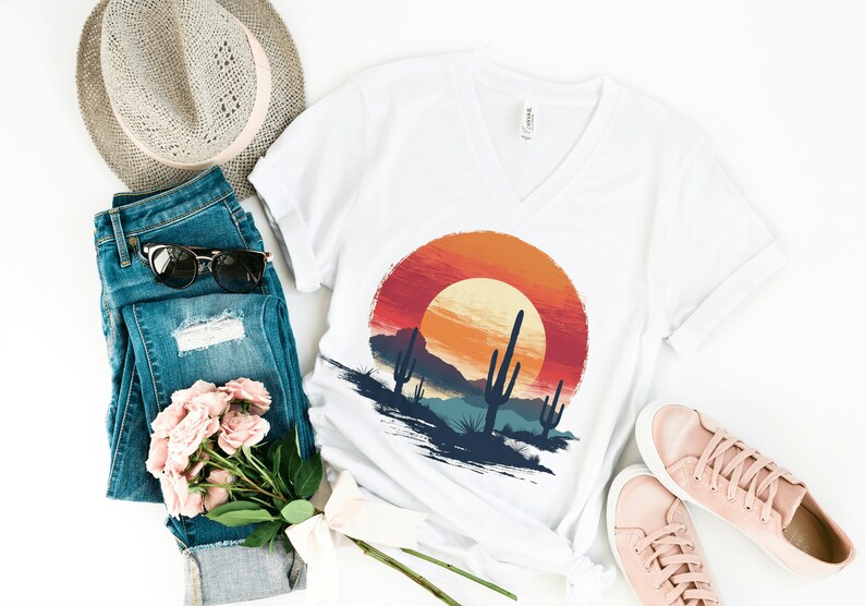 T-shirt with desert scene print with sunset and cactus.