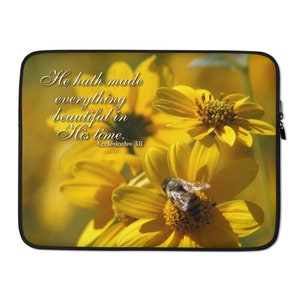 May include: A laptop sleeve featuring a yellow flower and a bee, with a quote from Ecclesiastes 3:11: "He hath made everything beautiful in His time."
