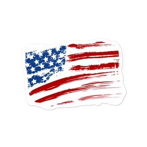 May include: A distressed American flag sticker with a white background. The flag is red, white, and blue with a brushstroke effect.