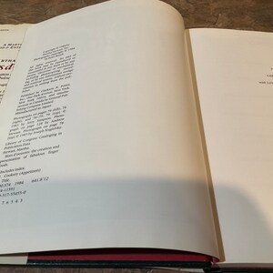 May include: A white book with a red spine and black text on the cover. The title is "Martha Stewart's Hors d'oeuvres: The Creation and Presentation of Fabulous Finger Foods". The book is open to a page with copyright information and a dedication to the editor.