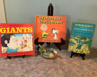 Freddy and the Flying Saucer Walter R Brooks, He's Your Dog Charlie Brown Door Charles M. Schulz, Or Usborne Book of Giants Christopher Rawson